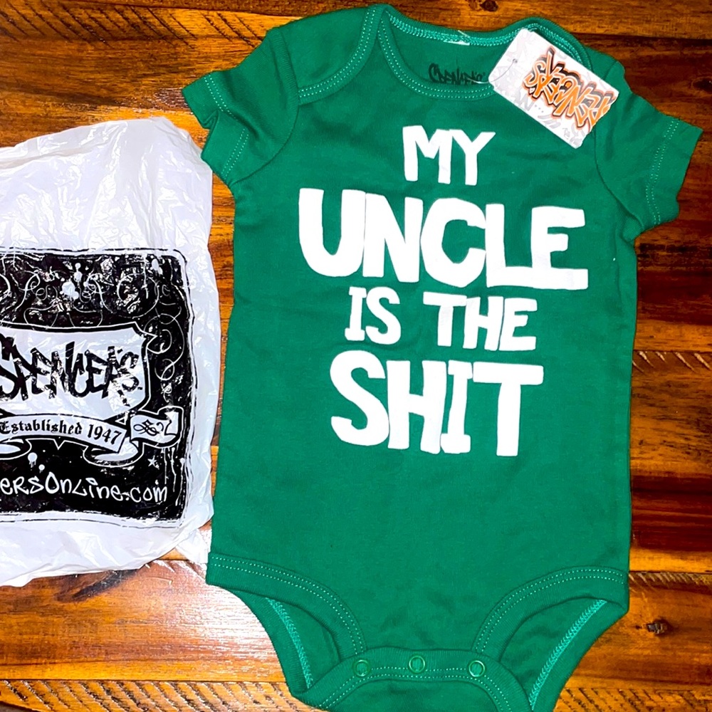 Spencer’s baby onesie.